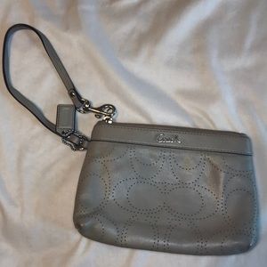 Gray leather Coach wristlet.
